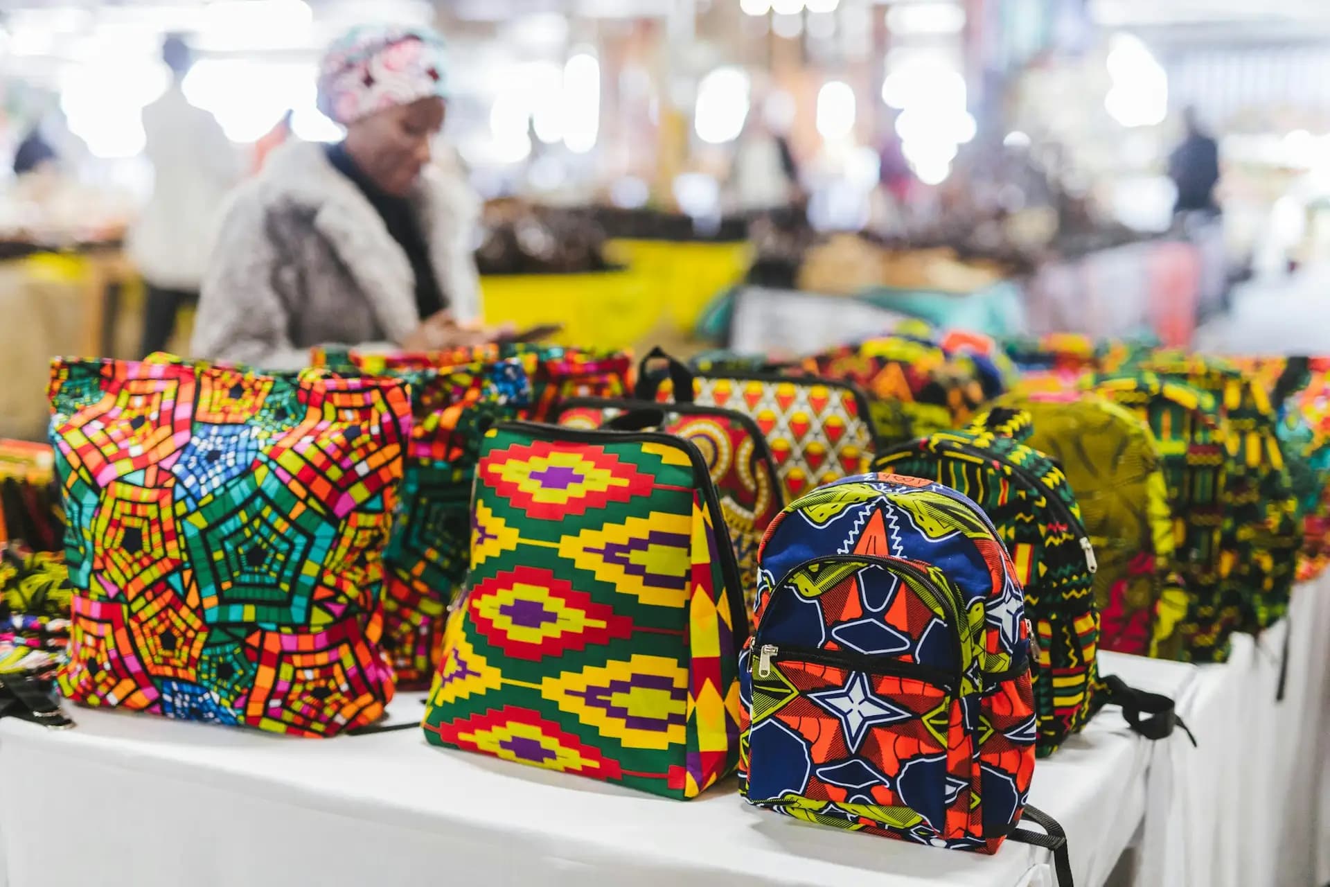 Colourful handmade bags on a market stall